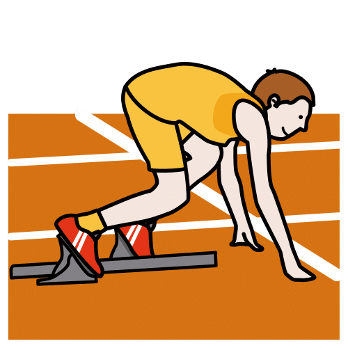 Una persona agachada tocando el suelo con los dedos en la línea de salida de una carrera.