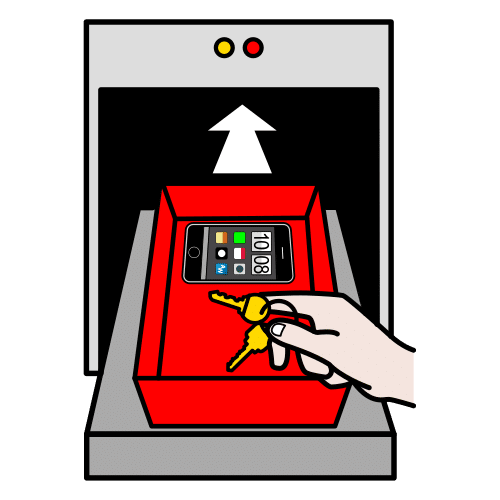 Una persona pone un móvil y unas llaves dentro de una caja roja.