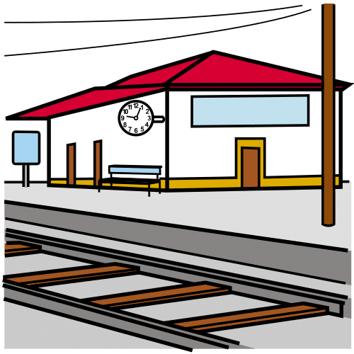 A la derecha de la imagen se ve un edificio blanco con techo rojo y un reloj en su perfil izquierdo. Justo delante hay un banco y una acera grande. Justo delante se ve la vía del tren.