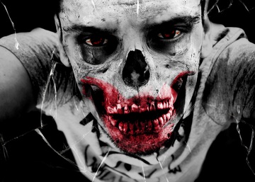 Imagen en primer plano de la cara de una persona maquillada en representación de la muerte.