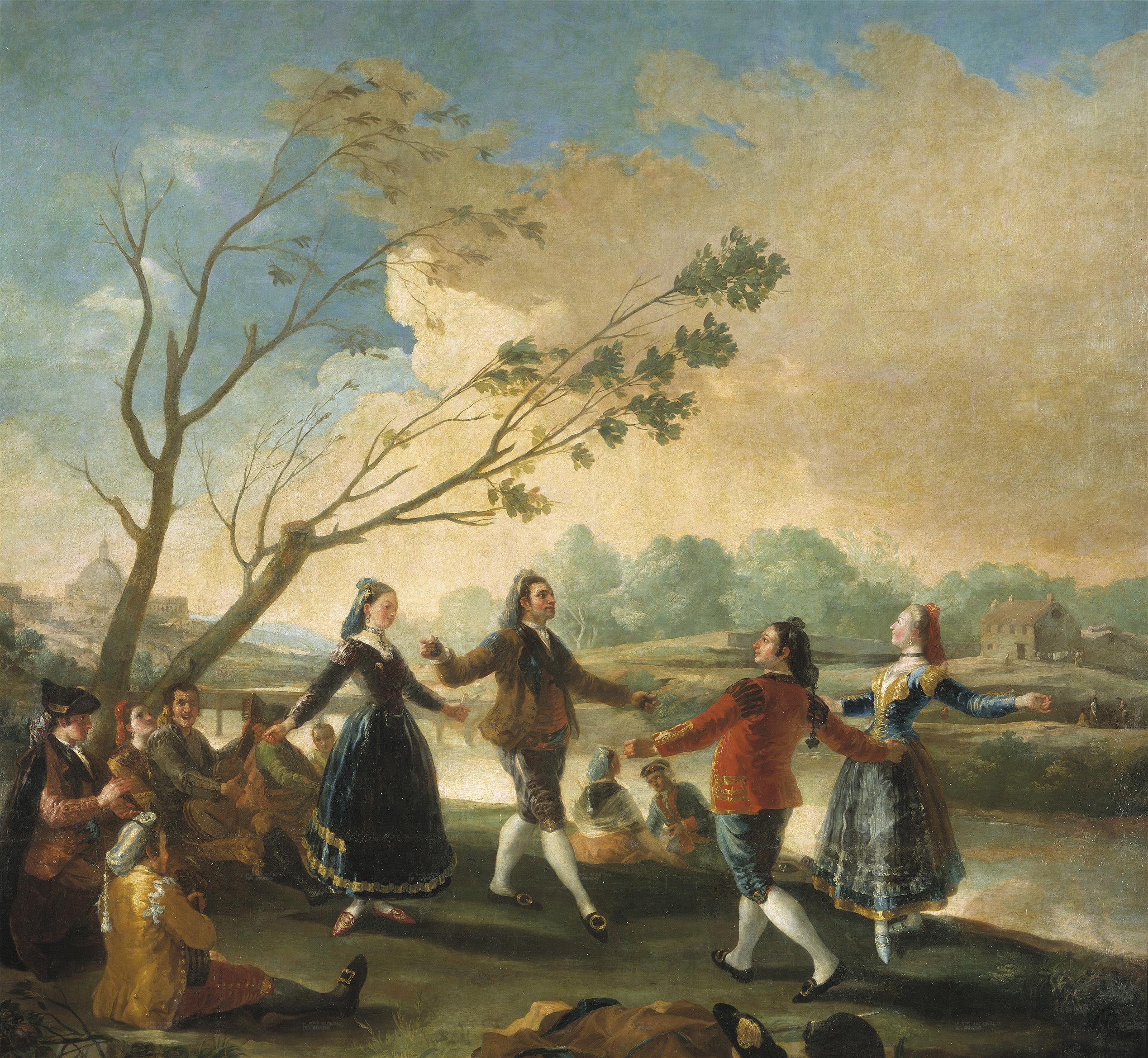 Un grupo de jóvenes bailan y tocan instrumentos a la orilla del río Manzanares