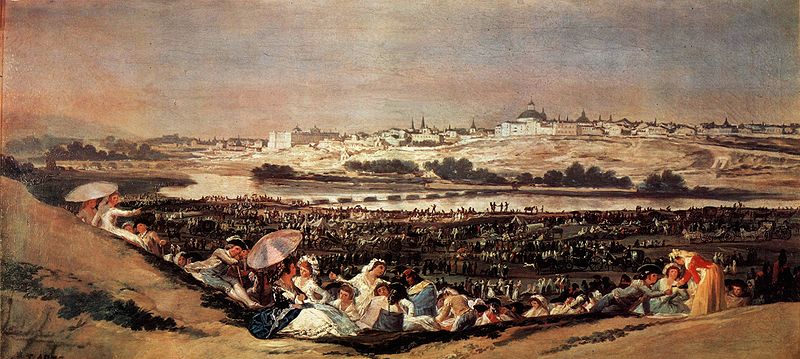 La pradera de San Isidro ocupada por centenares de personas que se divierten.