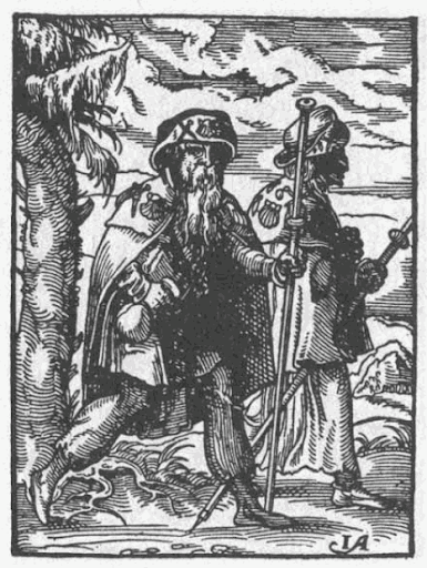 Imagen en blanco y negro de dos peregrinos con sus bastones.
