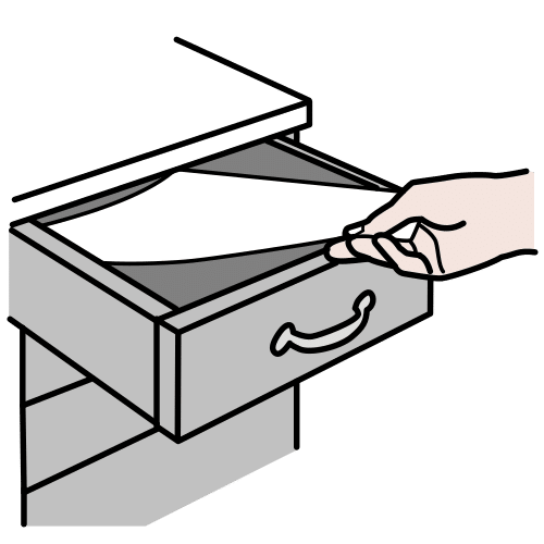 La imagen muestra un documento que se está introduciendo en un cajón.