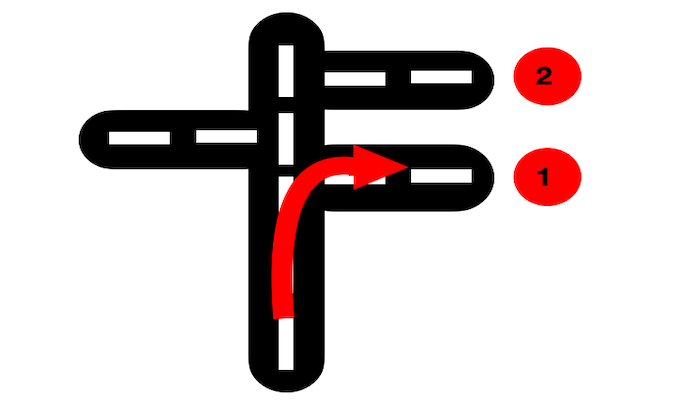 Imagen de varias calles, y aparece una flecha roja que indica que se debe coger la primera calle