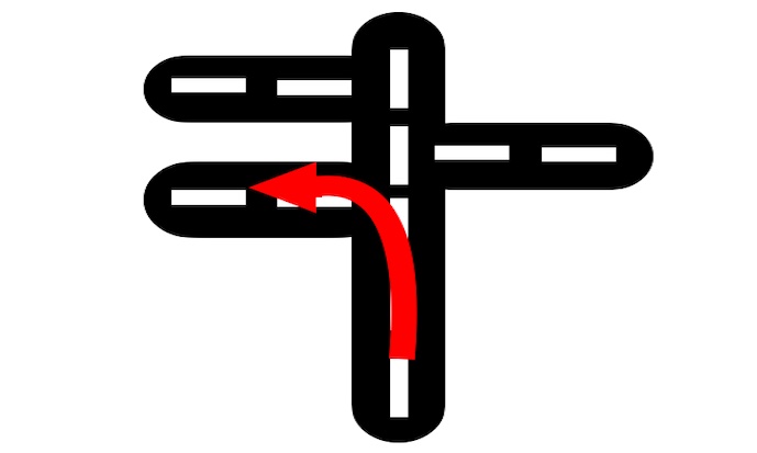 Imagen de una carretera y una flecha roja indica la acción: “girar a la izquierda”.