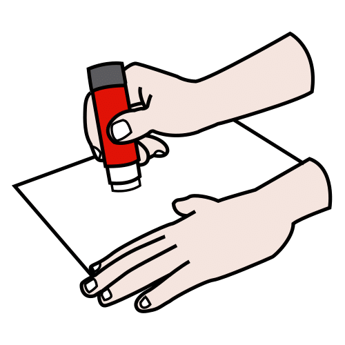 Unas manos pegando sobre un papel
