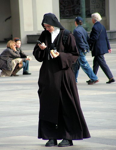 nun with mobile