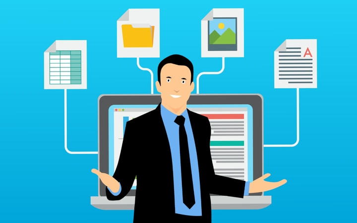 La imagen muestra una persona con traje de chaqueta y corbata delante de un gran monitor de ordenador del que salen cuatro hilos que conectan con cuatro elementos de trabajo digital.