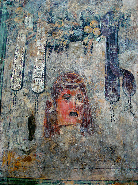 fresco con máscara teatral