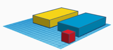 imagen que muestra tres figuras sobre un plano de color azul. Una figura amarilla y otra azul de igual forma: como un dado alargado y más bajo que ancho (ortoedros), Una tercera figura de color rojo que tiene forma de dado. (un cubo)
