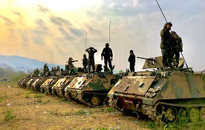 Soldiers on tanks