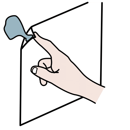 La imagen muestra una mano pegando papel con blu-tack