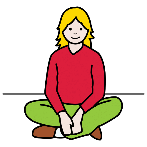 La imagen muestra a una mujer sentada en el suelo