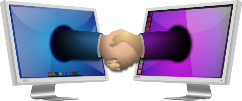 La imagen muestra dos monitores de ordenador que se presentan dándose una mano que sale de la pantalla.